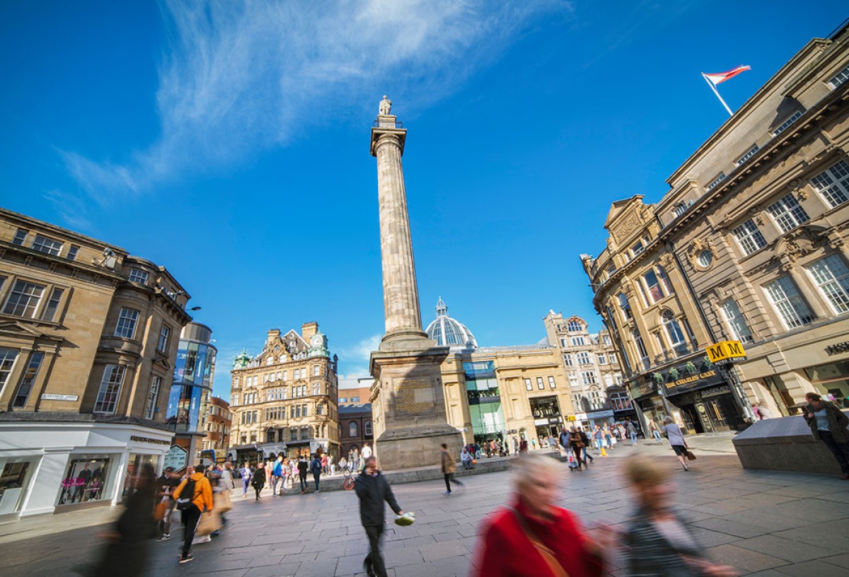 Grey's Monument towering over Grey Street